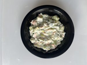 Gnocchi verdi con salmone e zucchine